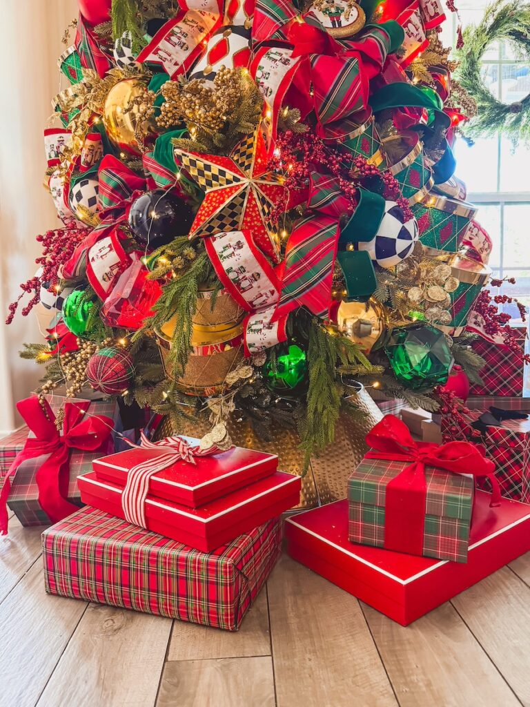 christmas presents around a nutcracker themed christmas tree