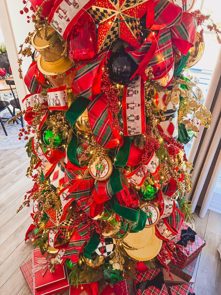 red green and tartan plaid christmas tree with drums and nutcrackers