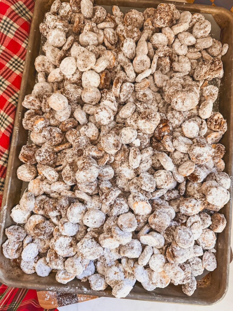 ritz bits puppy chow layered on a baking tray