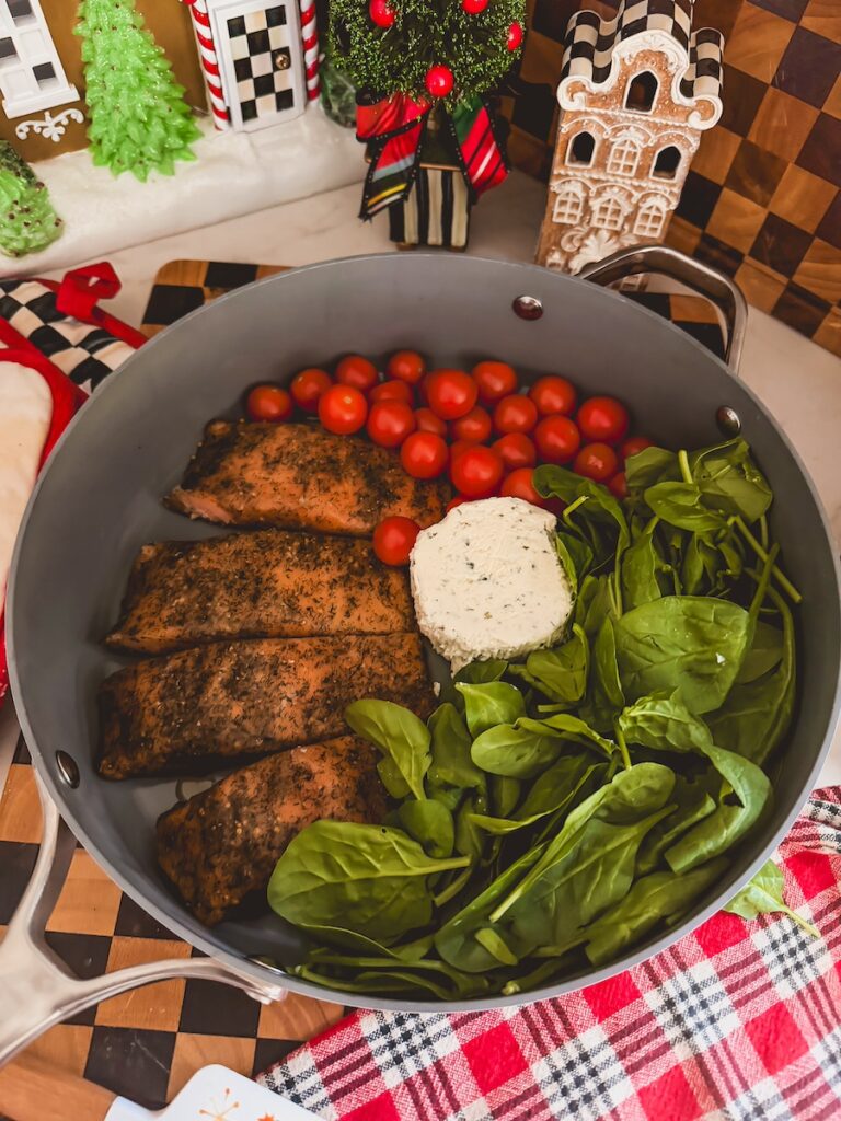 salmon, boursin, spinach, tomatoes in baking dish