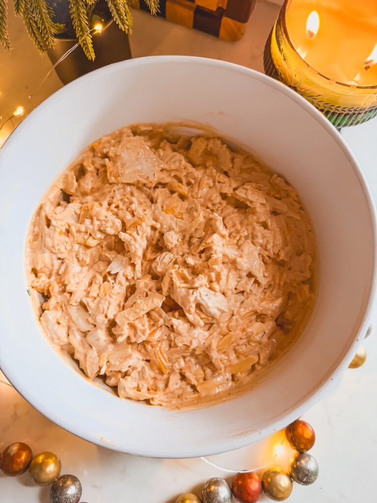 Greek yogurt and cheddar mixture for buffalo chicken dip.