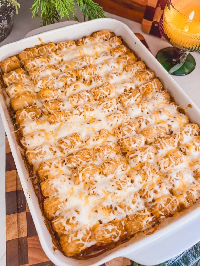 Baked Mexican tater tot casserole in a white baking dish.