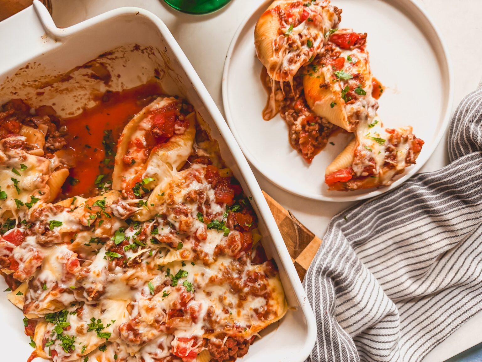 Stuffed pasta shells with halal ground beef ricotta Parmesan mozzarella in marinara sauce baked golden in a dish