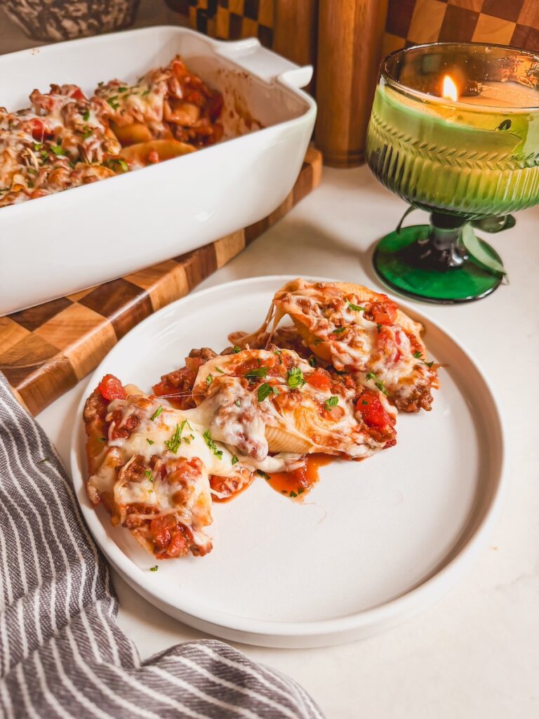 A plate with beef and ricotta stuffed shells.