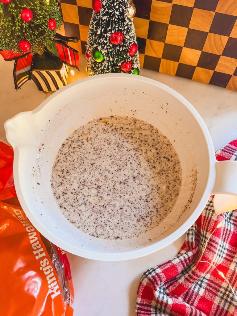 custard for cinnamon bread pudding in white mixing bowl