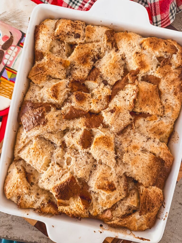 bread pudding baked in a white baking dish