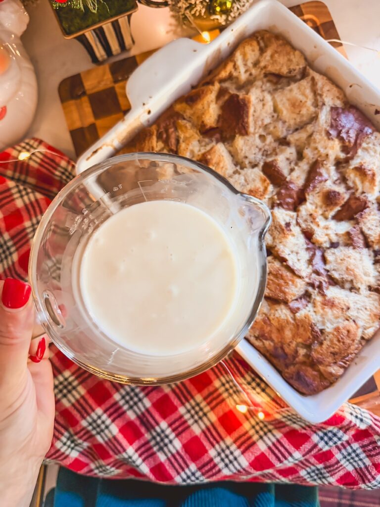 cream cheese glaze in a glass mixing bowl
