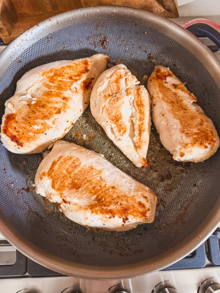 seared chicken in frying pan