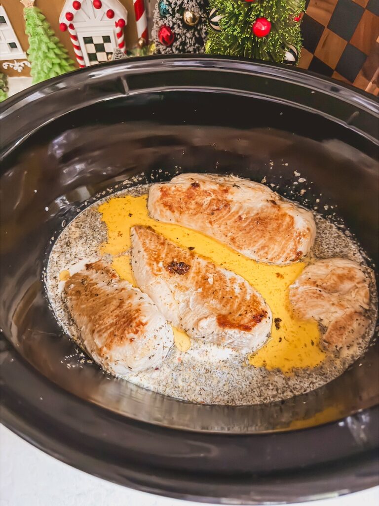 chicken with sauce in the slow cooker