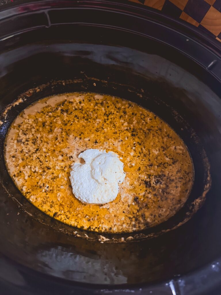 adding farmers cheese to sauce in slow cooker
