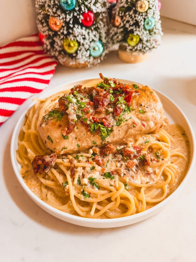 slow cooker marry me chicken served with spaghetti