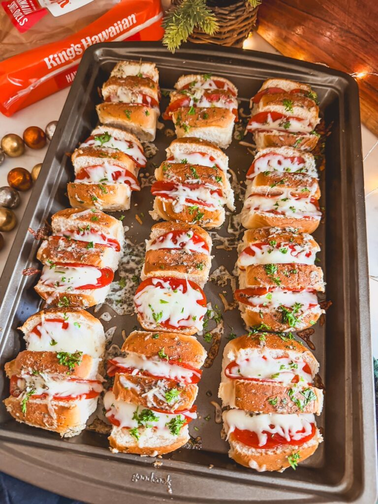 pepperoni pizza rolls on baking sheet with kings Hawaiian sweet rolls