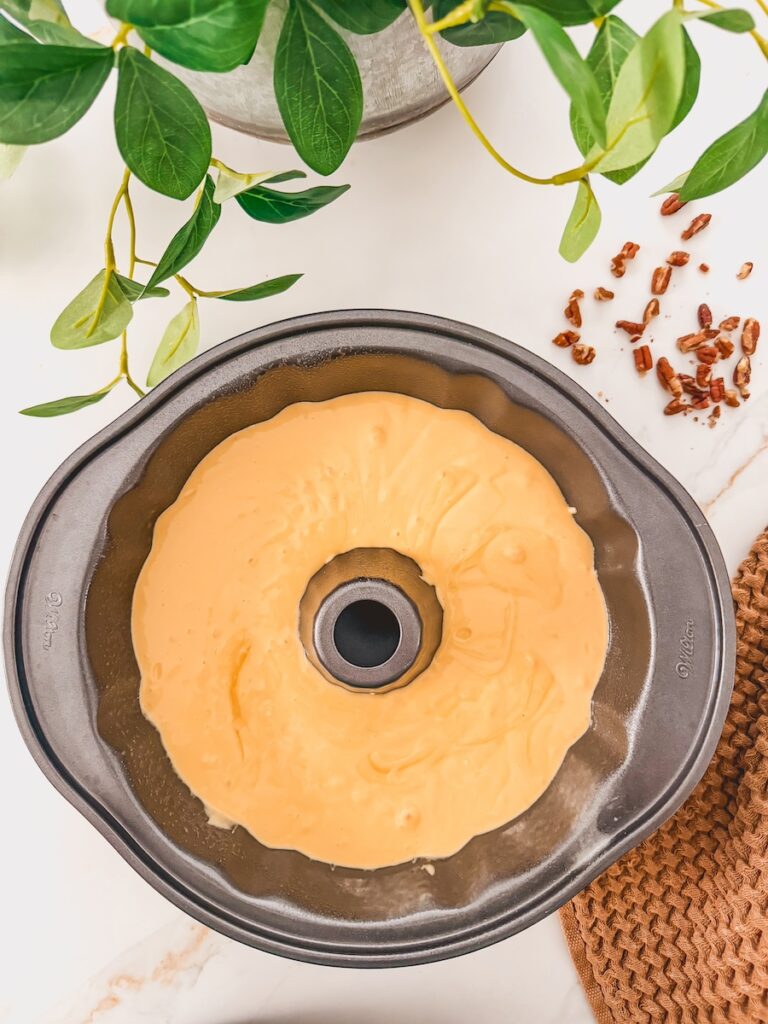 A bundt pan with cake batter for Baileys Irish Cream Cake.