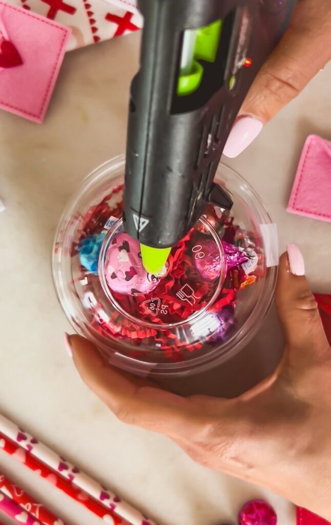 use a hot glue gun to melt a hole for the pencil