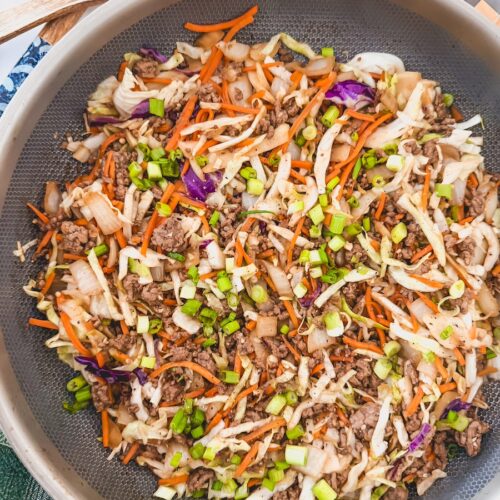 overhead shot of skillet of egg roll in a bowl