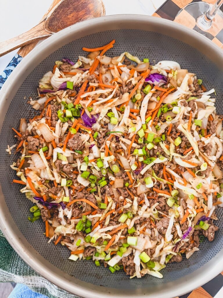 overhead shot of skillet of egg roll in a bowl