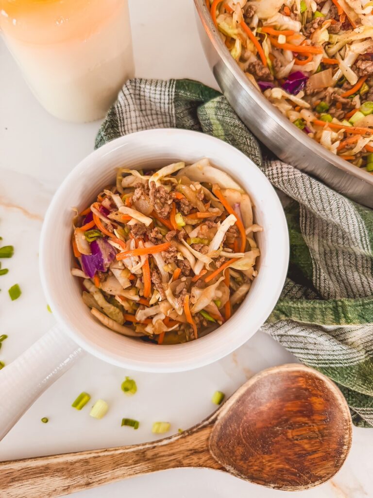 close up shot of egg roll in a bowl in a white bowl