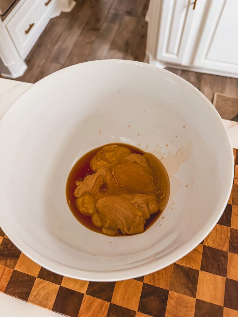 cashew butter and vanilla extract in white bowl