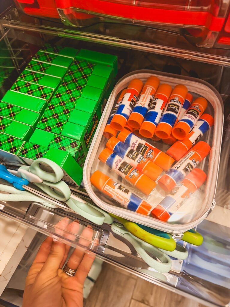 close up of clear drawer with office supplies