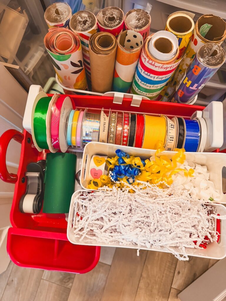 close up of wrapping paper cart with ribbon holder and bows