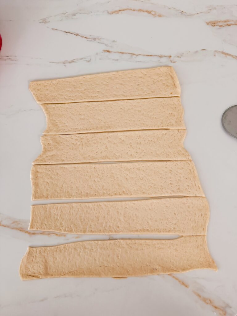 pizza dough sliced into 2 inch strips