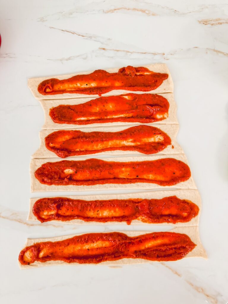 sauces spread out on dough