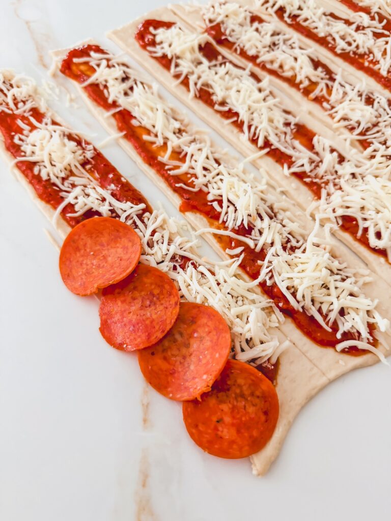 pepperoni slices added to dough