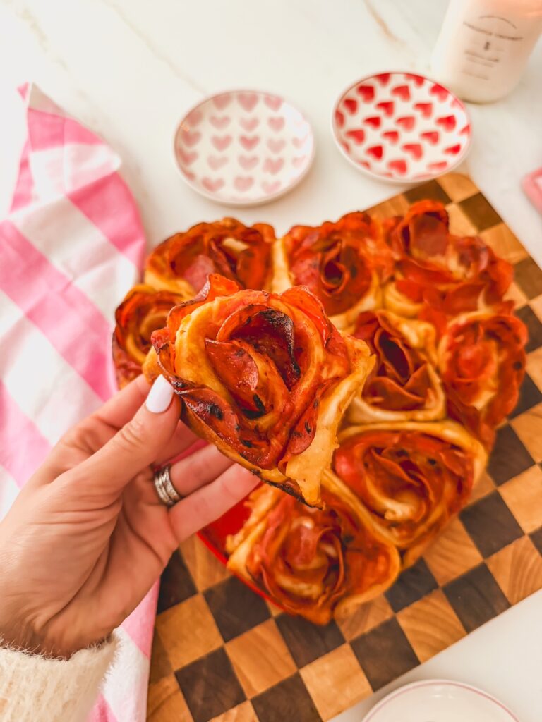 pizza rose pulled out and close up of holding a rose