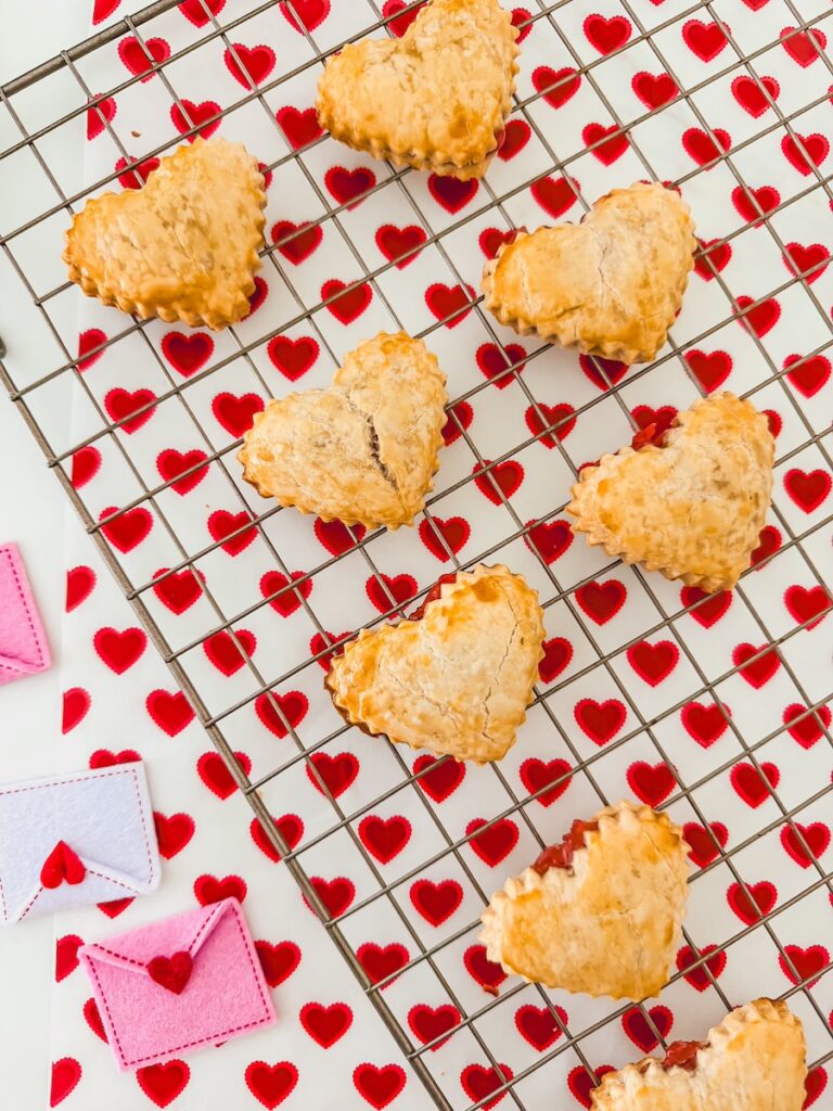 heart shaped strawberry pop tarts on baking rack