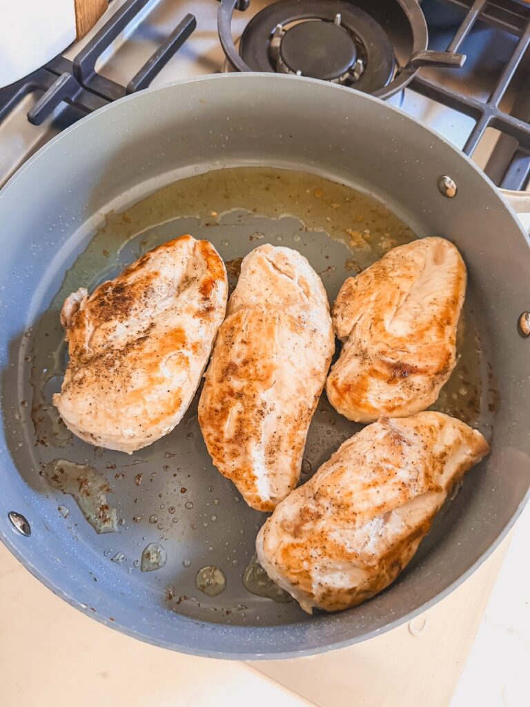 seared chicken breasts in pan