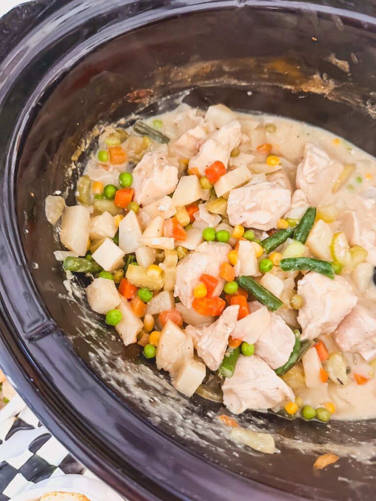 slow cooker chicken pot pie in the base of a slow cooker