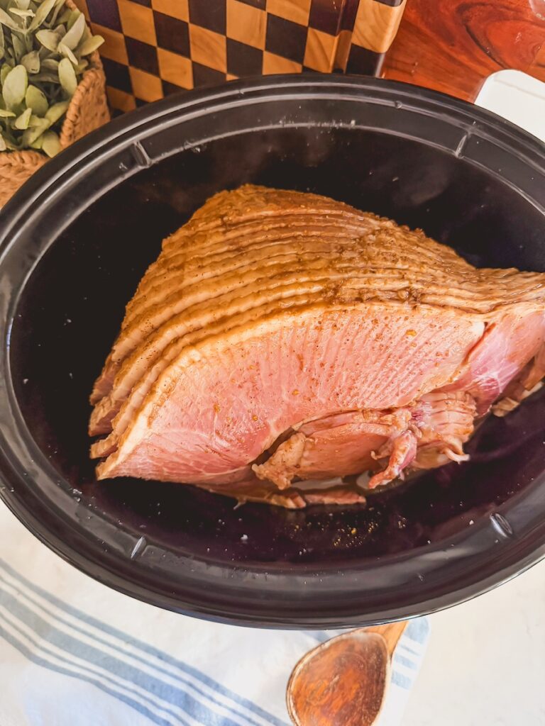 sliced coca cola ham in a slow cooker