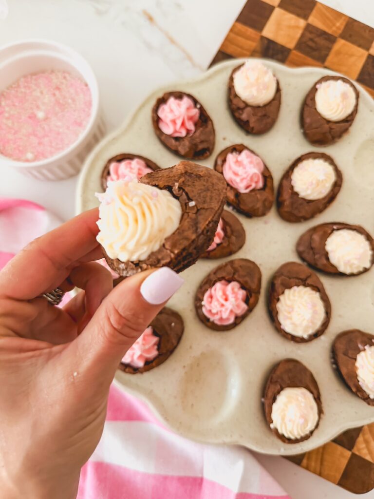 close up of deviled brownie with white frosting and sprinkles