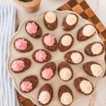 chocolate deviled brownies with frosting on tray