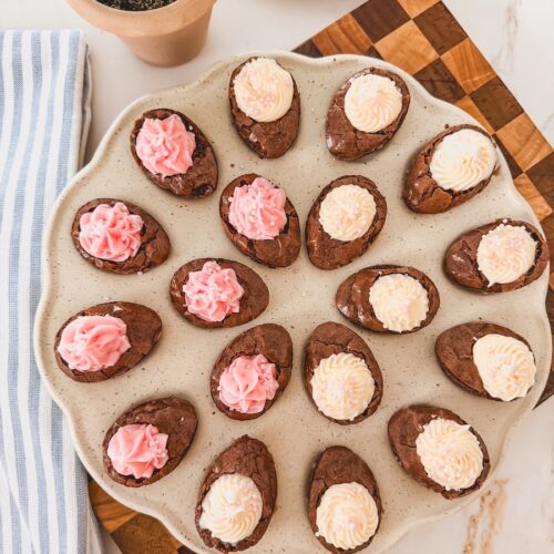 chocolate deviled brownies with frosting on tray
