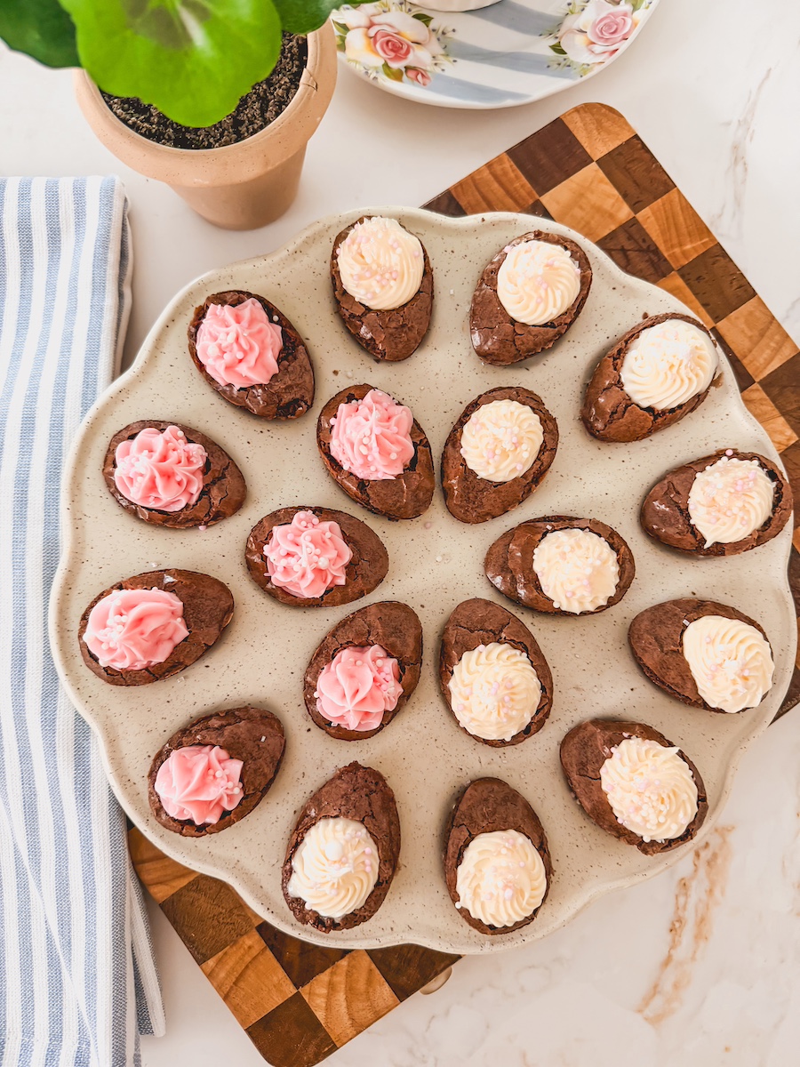 chocolate deviled brownies with frosting on tray