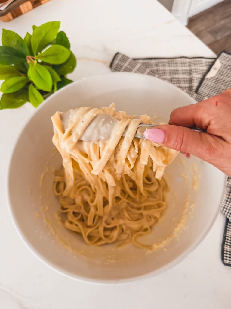tongs with fettuccini alredo