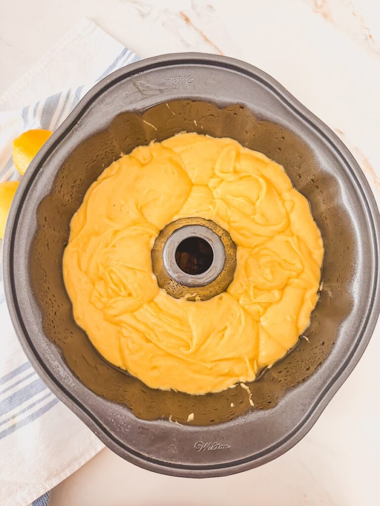 lemon bundt cake batter unbaked in bundt pan