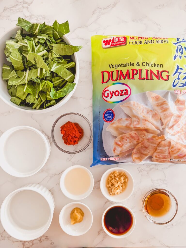 flat lay of ingredients for one pan dumpling bake