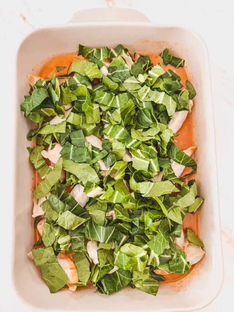 bok choy ontop of dumplings in baking dish