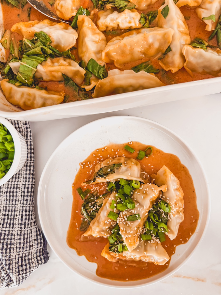 one pan dumpling bake on a white plate with baking dish