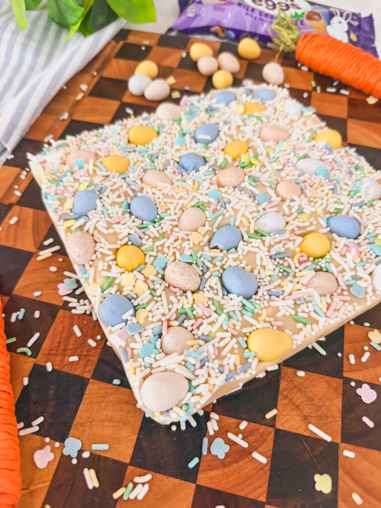 cake batter fudge with easter sprinkles on cutting board