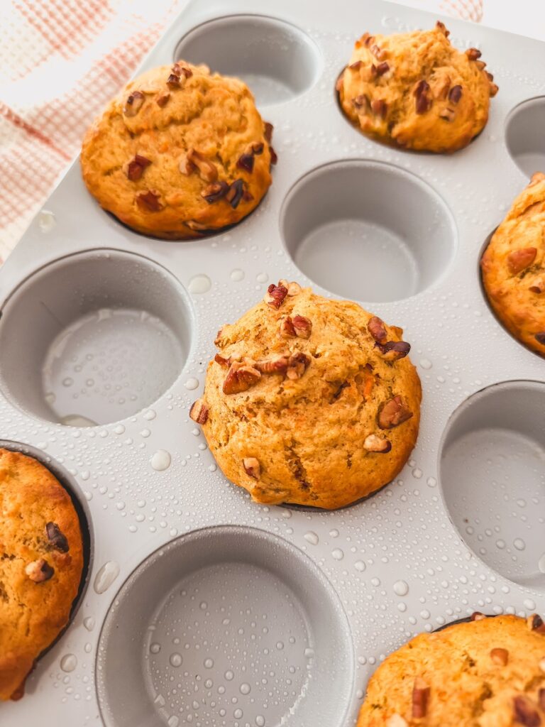 Carrot banana muffins baked in a muffin tin.
