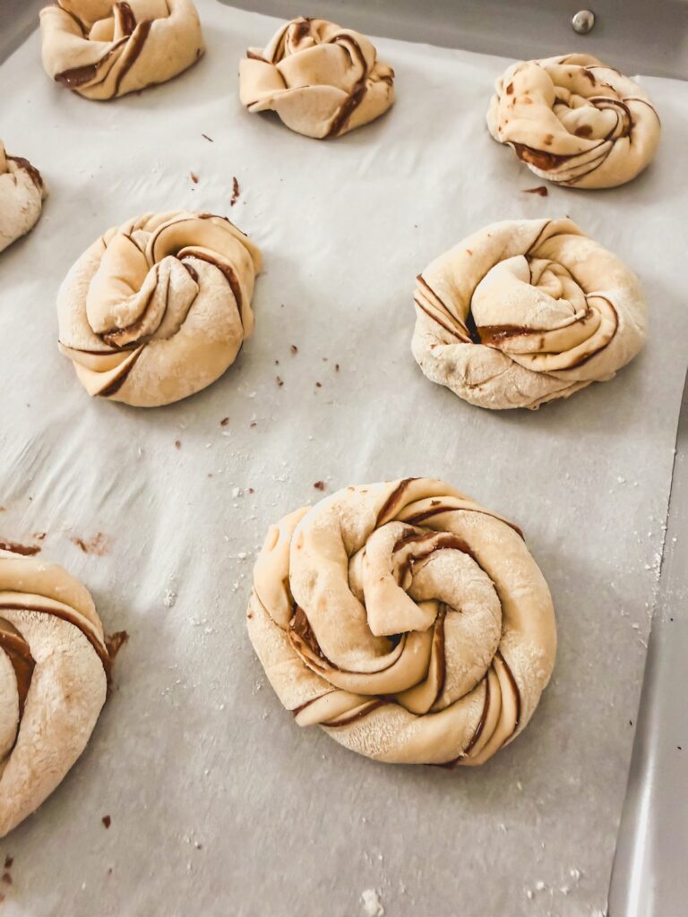 close up of puff pastry nest on parchment paper