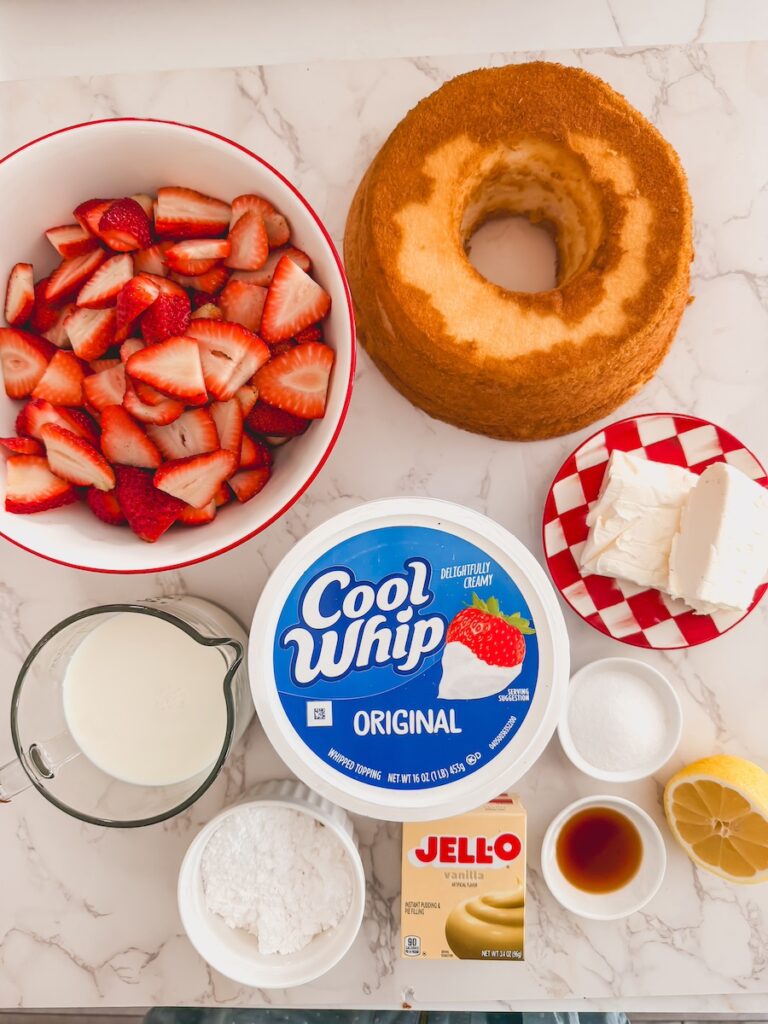 strawberry shortcake trifle ingredients on marble counter