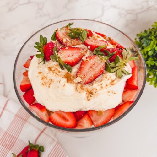another birds eye view of strawberry shortcake trifle in glass trifle dish on counter