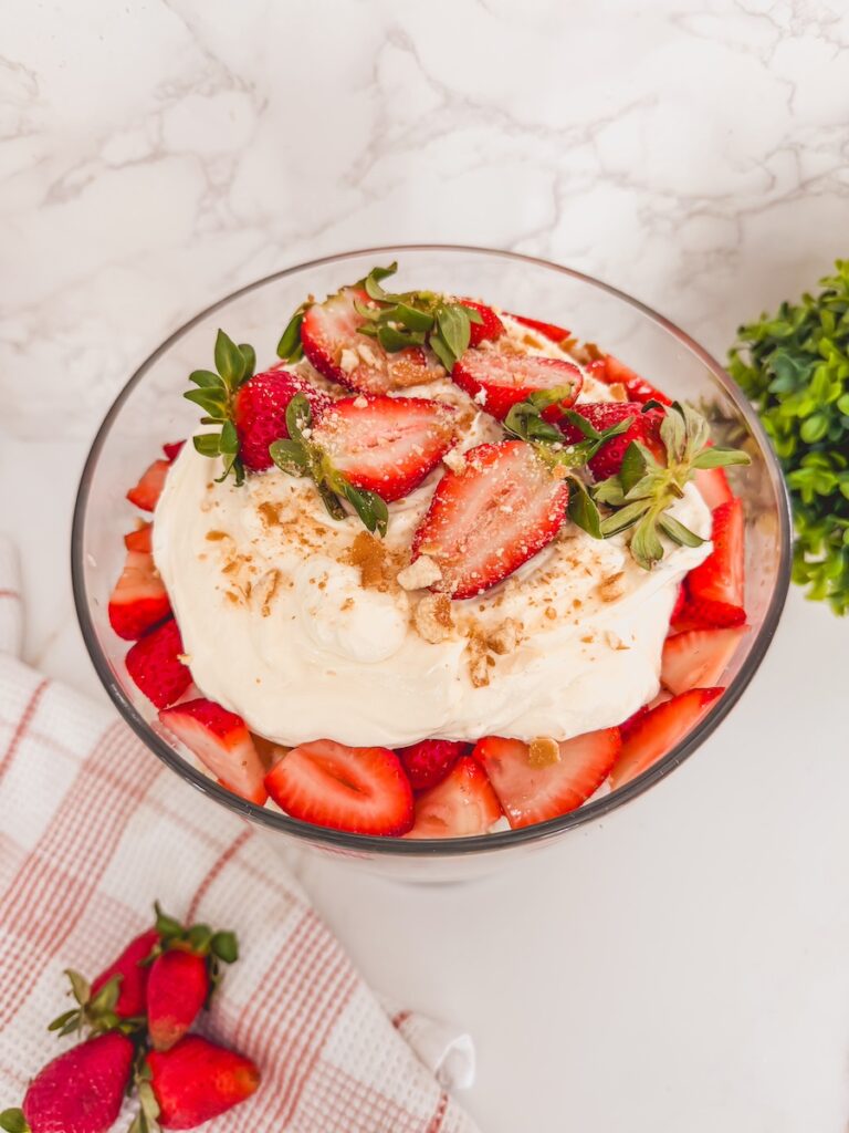 another birds eye view of strawberry shortcake trifle in glass trifle dish on counter