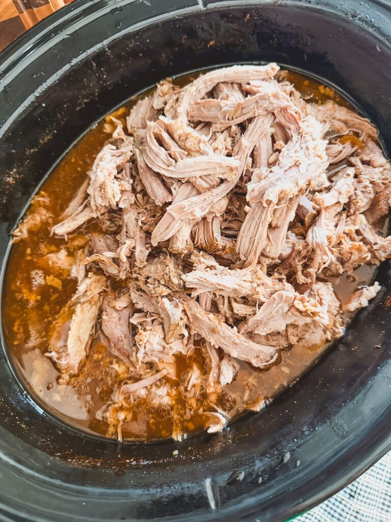 shredded cooked pork in slow cooker