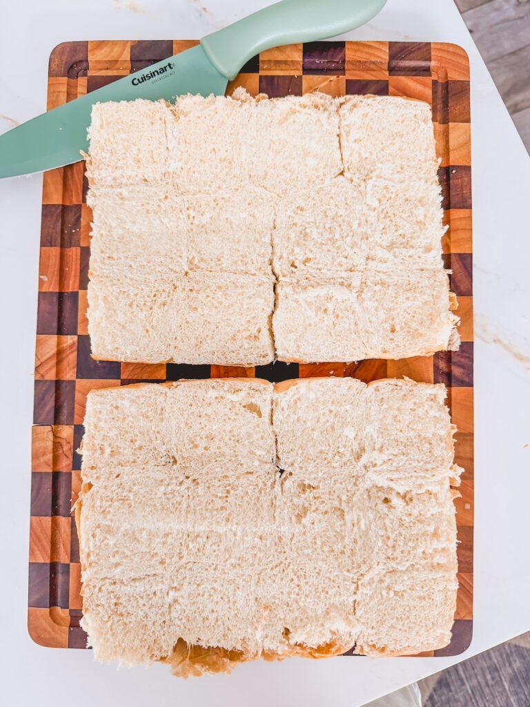 kings hawaiian roles sliced on counter with knife and cutting board