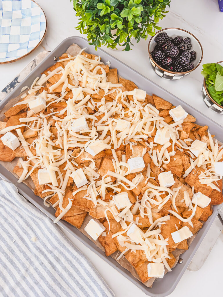 Brie, mozzarella,  scattered over chips before baking